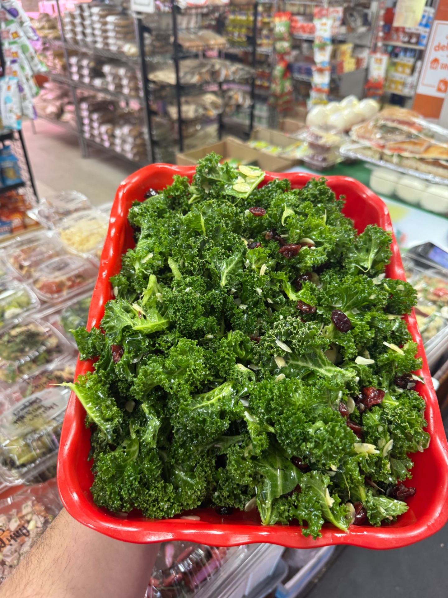 Kale salad with dried cranberries and slivered almonds