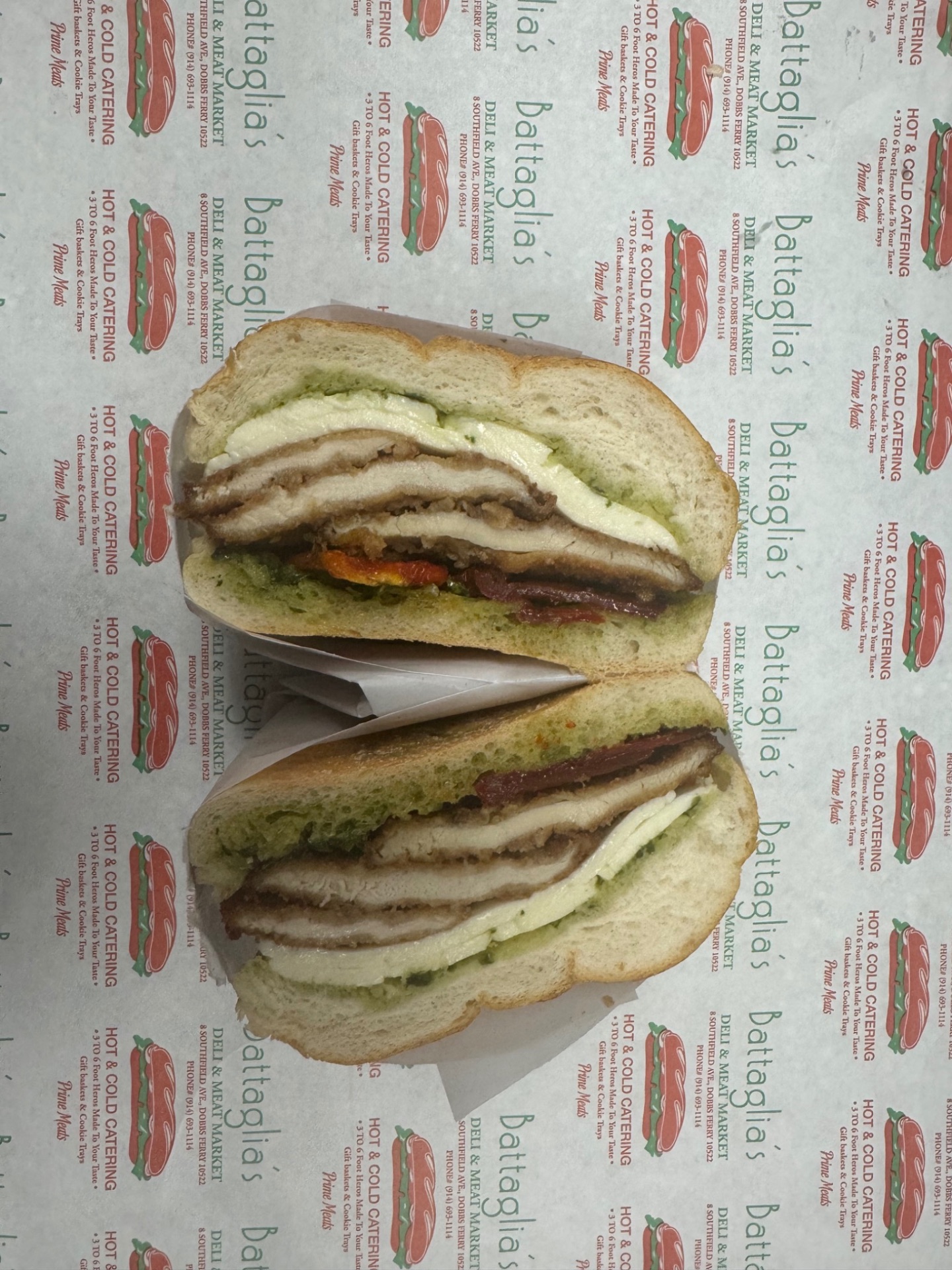 Chicken cutlet sandwich with fresh mozzarella, pesto and roasted peppers