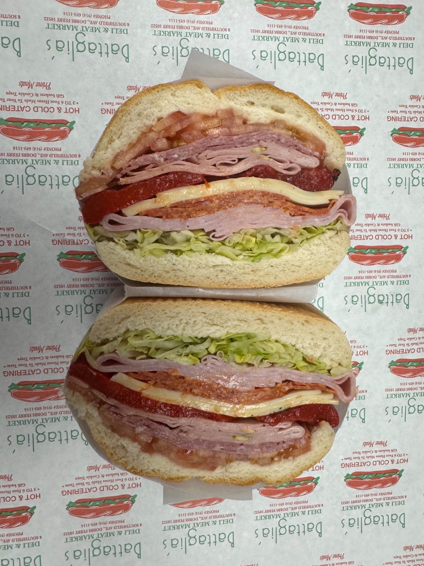 Overstuffed Italian combo hero with soppressata, ham, provolone and roasted peppers